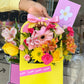 Canasta de flores amarilla
